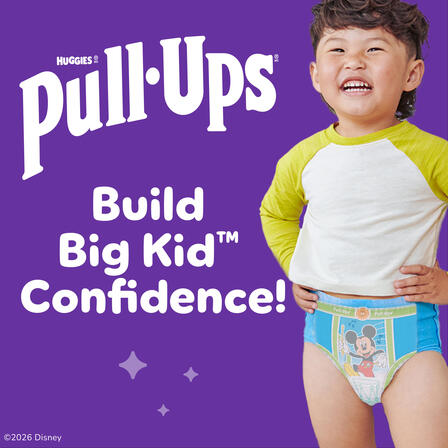Niño pequeño con ropa interior Pull-Ups sobre fondo morado junto al texto “Huggies Pull-Ups” y “Build Big Kid Confidence!”